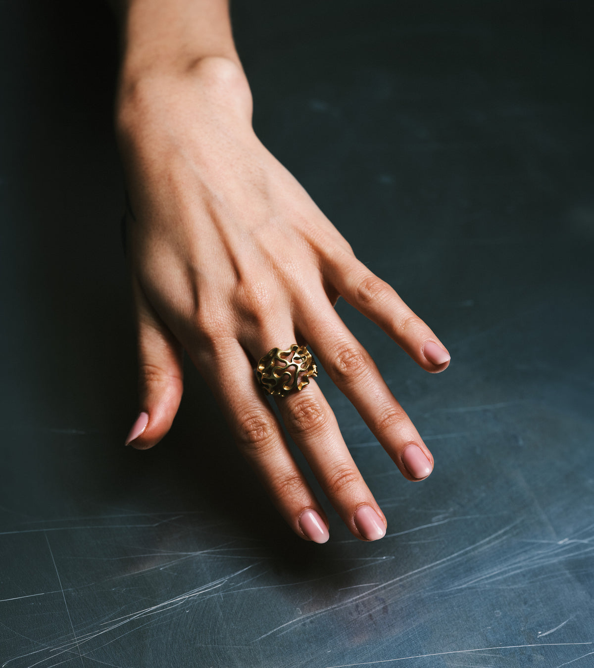 AION Ring worn on the hand